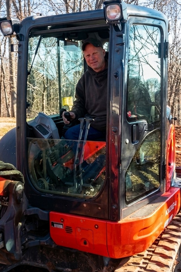 Sioholm Excavation operator in an excavator on a Connecticut job site