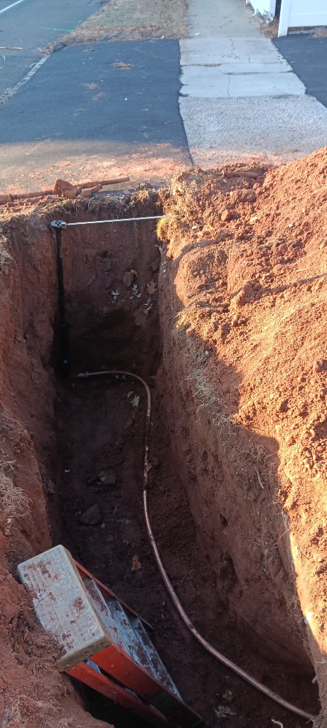 Water main and service line trench work in Connecticut